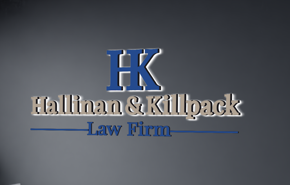 Halo-lit dimensional lobby sign for Hallinan & Killpack Law Firm on an interior office wall