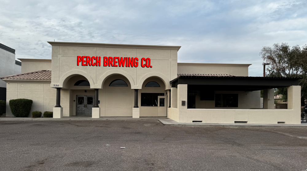 Perch Brewing Co. building letters mounted high on a fascia, read from the parking lot